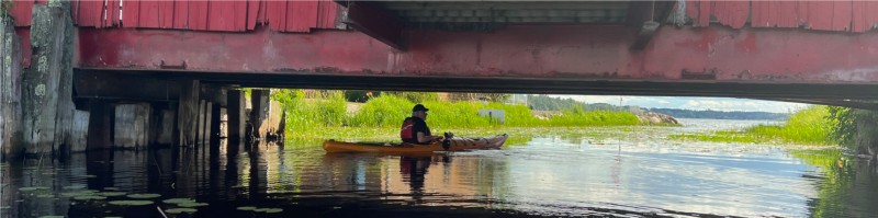 kayak under a covered bridge